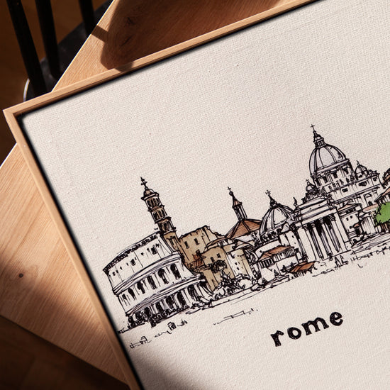 Rome Colosseum watercolor on canvas with light oak frame styled in a living room