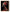 le tableau de Profil d'une femme noire met en valeur l'identité et la force de la femme africaine, magnifiquement mise en lumière par une parure de perles rouges