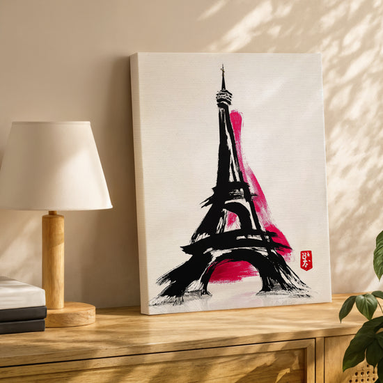 Modern Eiffel Tower canvas on oak sideboard with table lamp, black and fuchsia palette