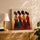 African women with tribal jewelry wall art for living room, styled with oak sideboard and lamp