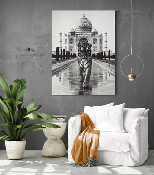 A black and white canvas featuring a tiger completes a cozy reading nook with a plush chair.