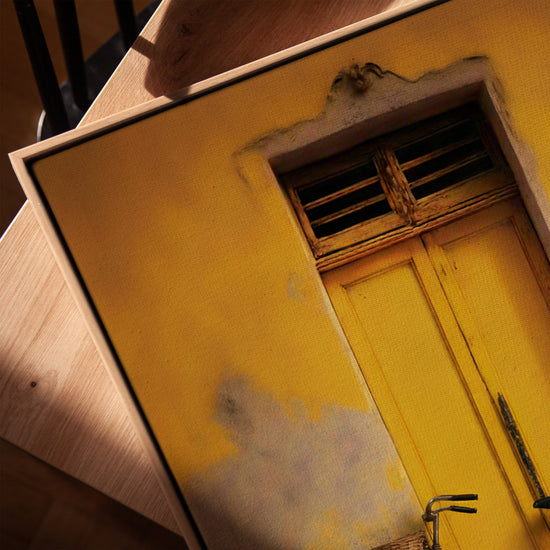 Yellow vintage bicycle wall art for a minimalist office