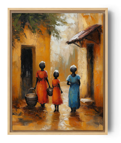 Wandbild mit drei afrikanischen Frauen in farbenfrohen Gewändern, die durch eine ockerfarbene Gasse gehen. Die warme und traditionelle Atmosphäre verleiht eine ethnische Note, ideal für eine vom Reisen inspirierte Wanddekoration.