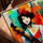 Colorful cellist portrait painting in a golden oak frame for living room decor