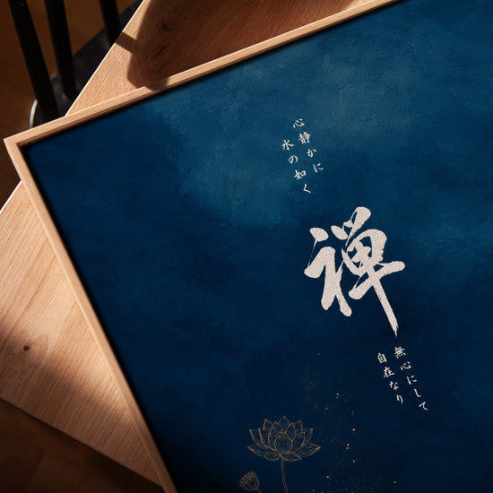 Zen canvas with gold lotus and calligraphy on deep blue, styled on a modern console
