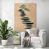 Decorative wall art with stylized tree on earthy tone and ink wash, zen ambiance in an elegant living room