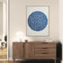 Blue circular calligraphy art in a contemporary minimalist living room, artistic decorative style