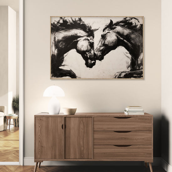 Decorative artwork of two horses in black and white, expressive style in a contemporary living room.