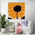 Modern abstract floral canvas with orange petals on a beige background, perfect for a bright living room