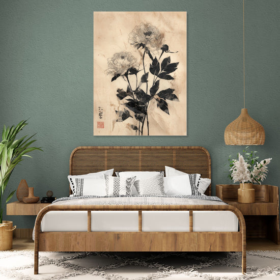 Asian floral art in black and beige on a green wall in a bohemian natural bedroom