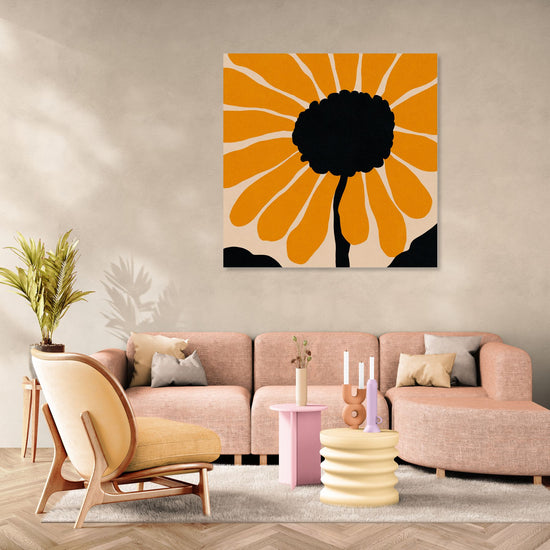 Modern floral wall art with vivid orange petals, styled in a soft pastel-toned living room