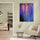 Vibrant purple and blue floral wall art in a modern minimalist living room