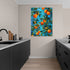 Vibrant oranges and green foliage wall art on a blue background for modern kitchen decor