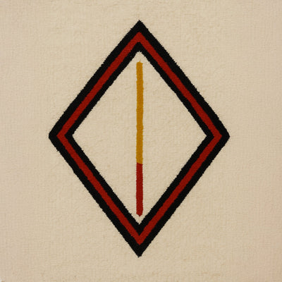 Geometric ethnic diamond pattern framing a yellow and red vertical line, woven on a natural beige background, reflecting a reimagined Berber design.