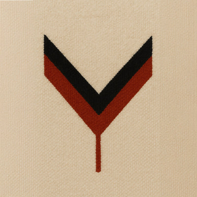 Contemporary Berber pattern with inverted chevron in red and black on an ecru wool background, a sleek graphic symbol inspired by Moroccan tribal art.