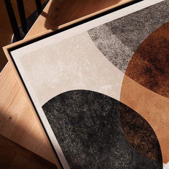 Abstract wall art with organic shapes in earthy tones for a minimalist living room