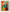 Tableau mural abstrait aux formes géométriques et tons chauds, accroché dans un salon contemporain pour une touche artistique et design.