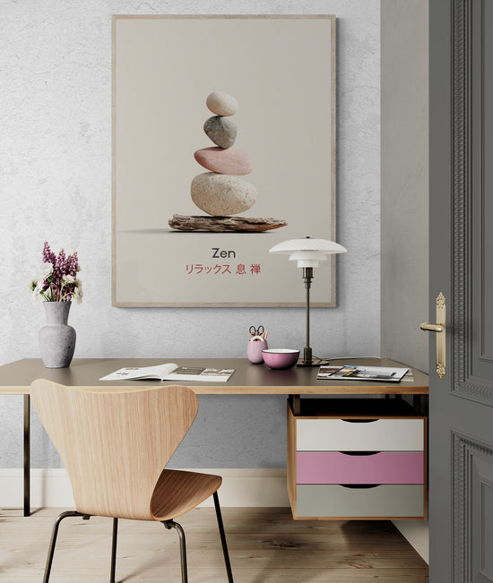 Zen wall art with stacked stones and Japanese calligraphy, displayed on the wall of a modern office with a wooden chair, designer lamp, light desk, and colorful storage drawers, contemporary decor ambiance