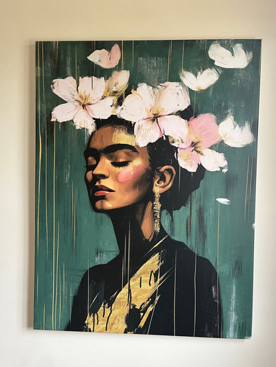 Customer photo of a modern Frida Kahlo–style canvas with raised pink flowers on an emerald green background, hung on a light wall. The piece evokes elegance and feminine strength.