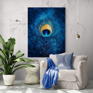 A modern canvas featuring a peacock feather painted in deep blue, with golden hues in the center. The frame is hung above a white upholstered armchair, adorned with a light blue cushion and throw. The space design emphasizes simplicity and elegance.