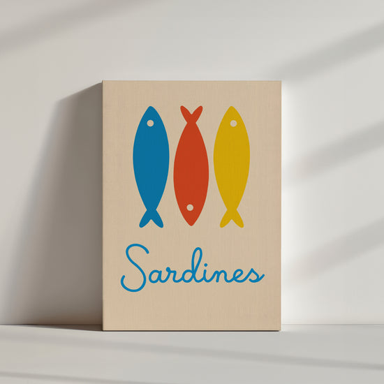 Minimalist interior with colorful Mediterranean sardines canvas print resting on the floor