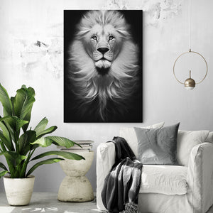 black and white lion painting hung on a white wall in a sleek white and gray living room.