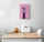 Original kitchen wall art hanging above a table and two white chairs