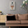 Small Nordic-style geometric wall art above a light wood sideboard in a modern living room