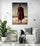 modern canvas art for living room featuring a Maasai warrior standing with a long staff in the desert