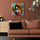 Painting of a woman with a cello, displayed as modern living room wall art